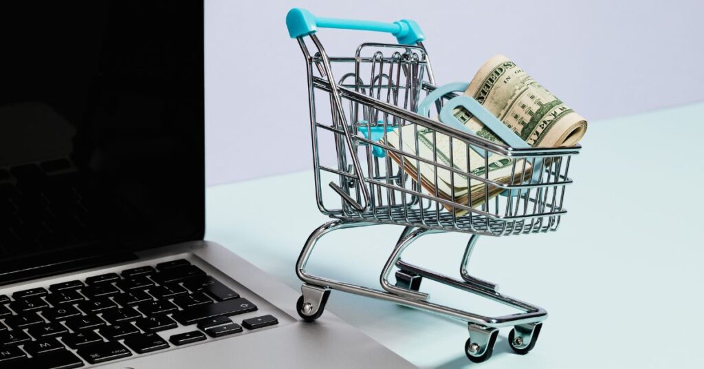 laptop shopping cart cash money